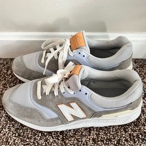 Size 10 New balance sneaker -grey with a few other soft colors. Only wore once.